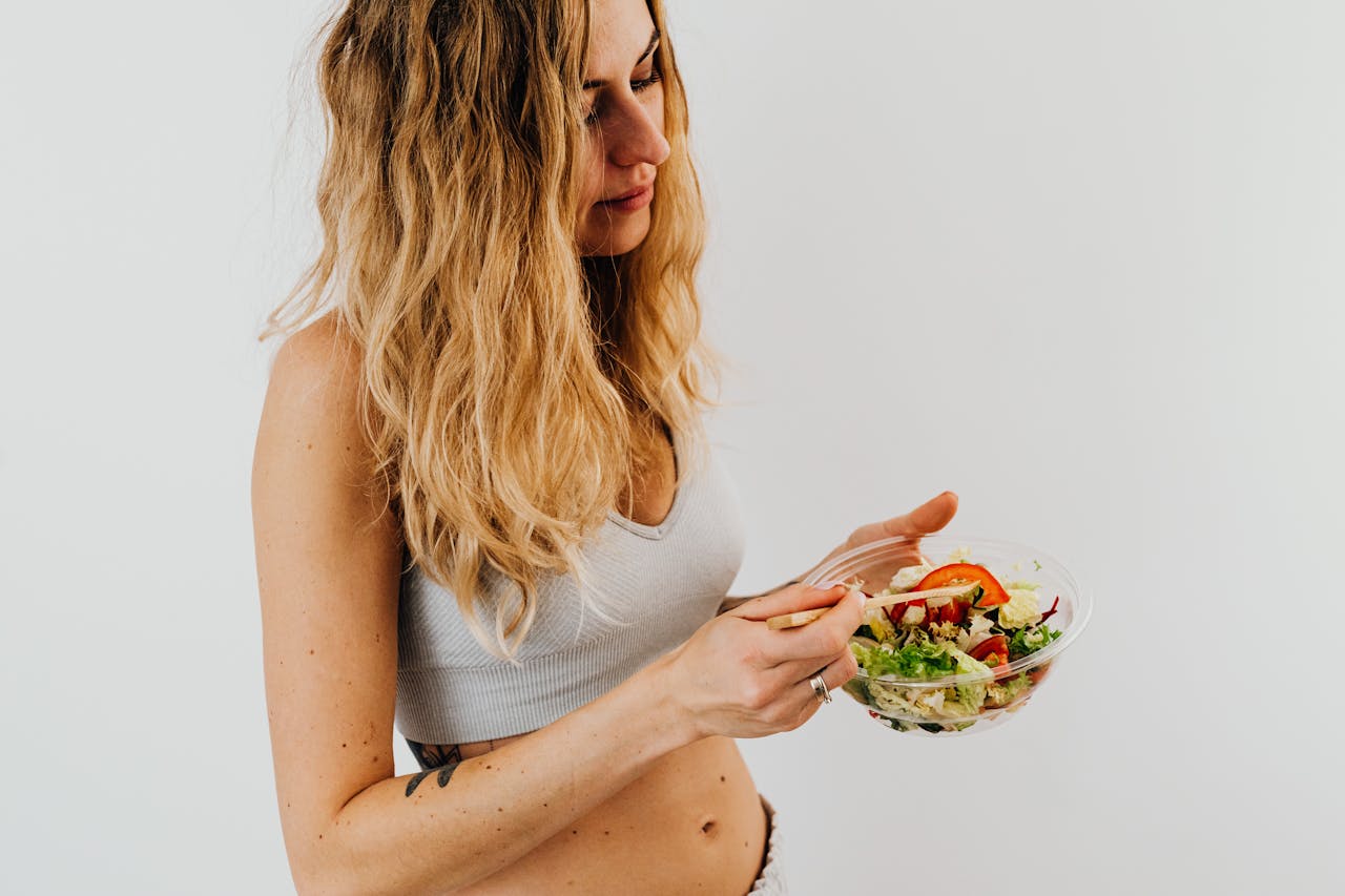 woman eating salad